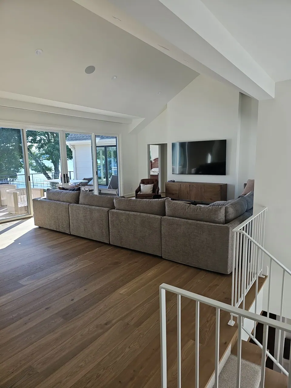 New-construction living room with fireplace and white painted built-ins